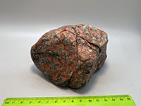 a red smooth jasper cut by multiple small fracture of gray chert.